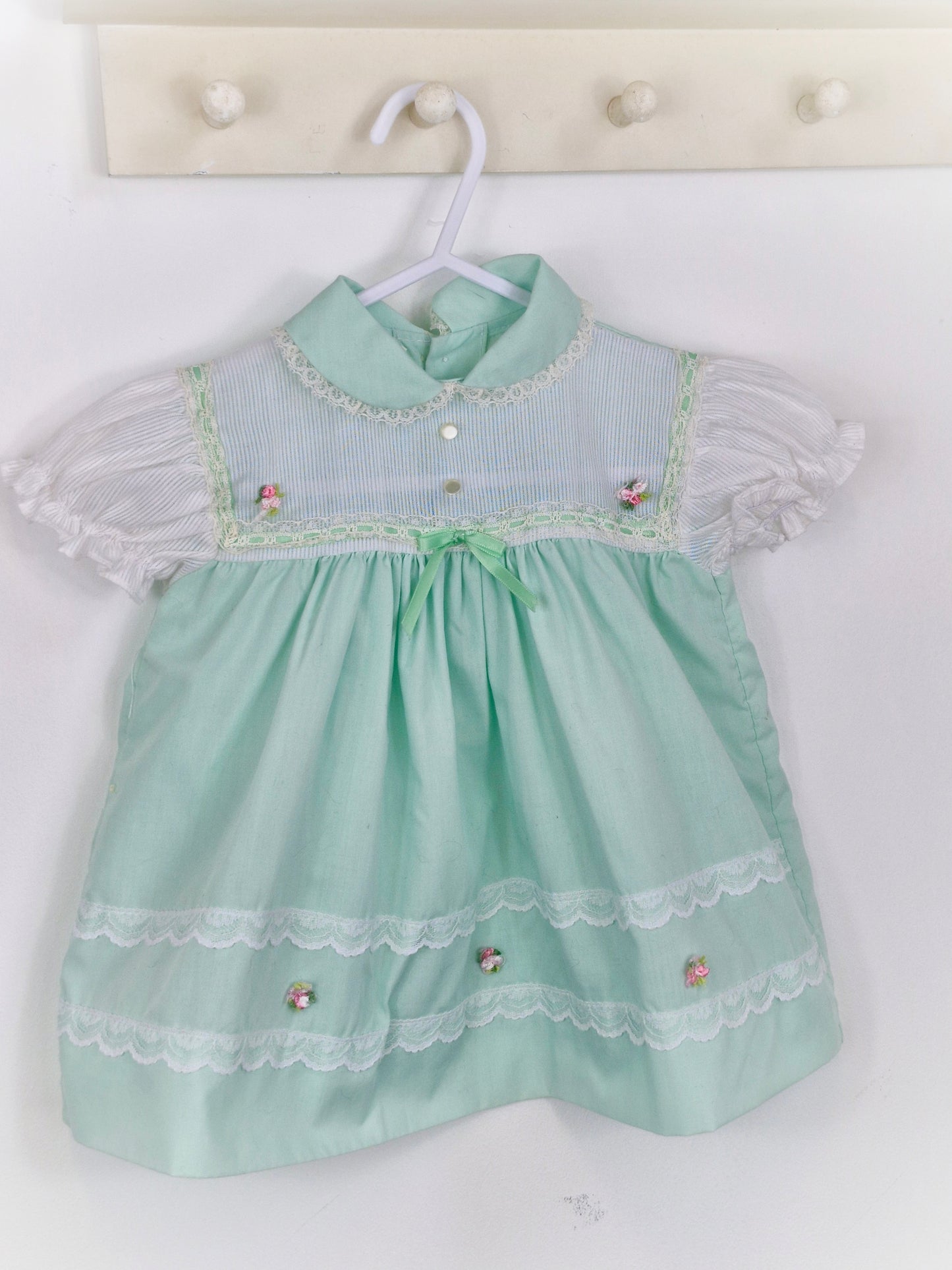12 months. Mint and white Cradle Togs with rosette, lace and ribbon details