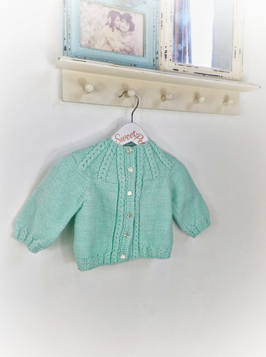 6-12 months. Hand knitted mint cardigan from the knitting needles of Audrey Seaton