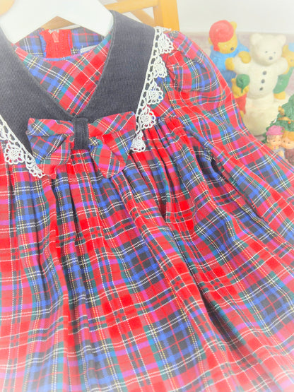 2 years. Vintage tartan dress with black collar, trimmed with lace and centered bow. Ruth of Carolina