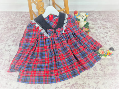 2 years. Vintage tartan dress with black collar, trimmed with lace and centered bow. Ruth of Carolina