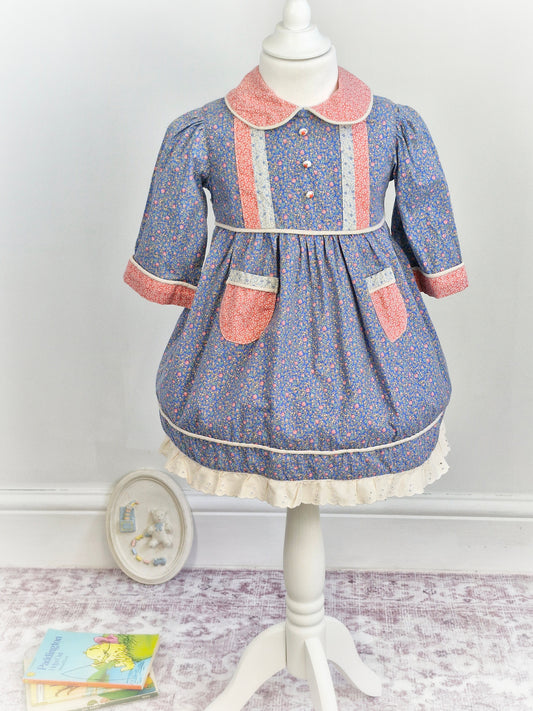 2-3 years. Floral dress with collar and rose buttons