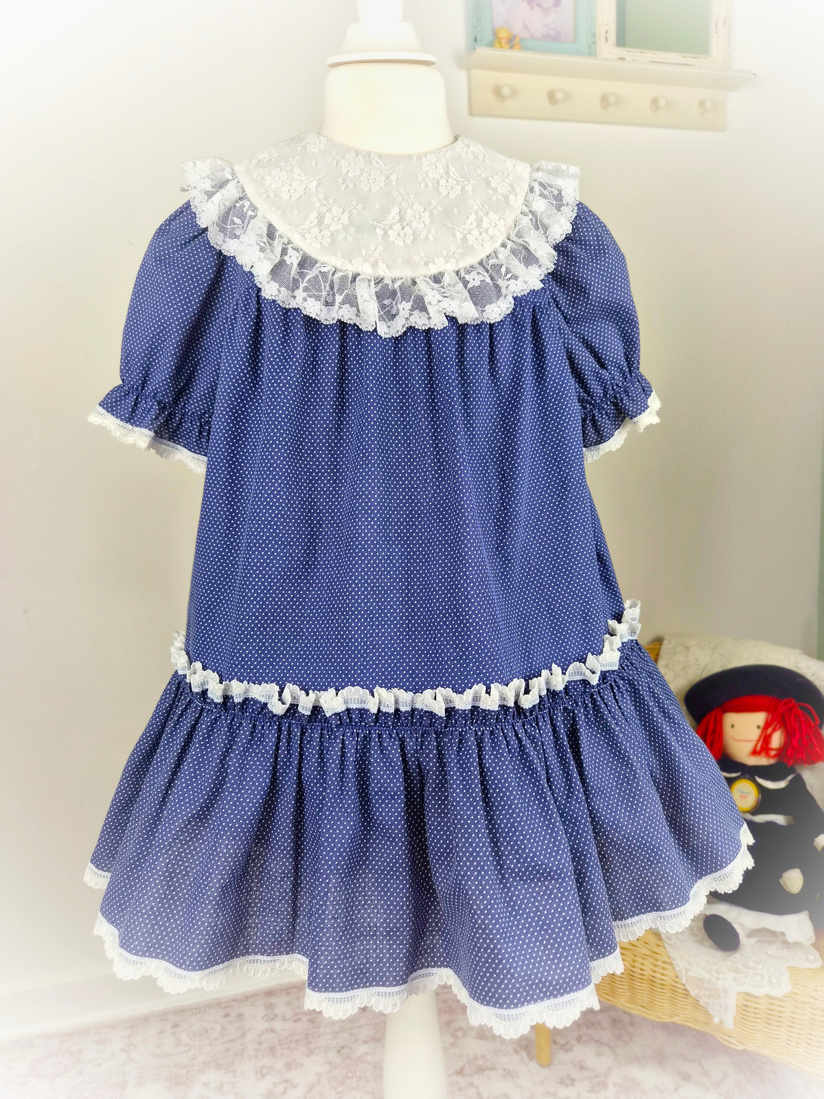 4-5 years. Navy polka dot vintage dress by Special Occasions with white lace bib and trim