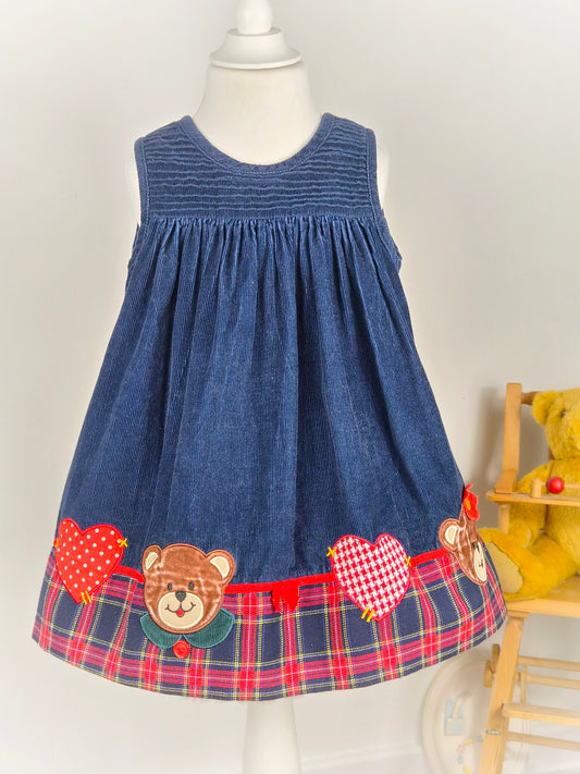 3 years. Navy corduroy sleeveless vintage Samara dress with tartan hem, gingham hearts and teddy appliques